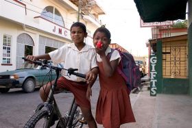 Belize boy and a bike and a girl – Best Places In The World To Retire – International Living